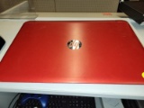 (BAY 7) RED HP LAPTOP (HAS A CHIP ON 1 CORNER OF BOTTOM). UNSURE OF WORKING CONDITION. NEED CHARGER.