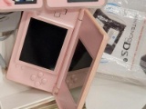 (BAY 7) PINK NINTENDO DS WITH BOX, CHARGER, AND 3 GAMES. ITEM IS SOLD AS IS WHERE IS WITH NO