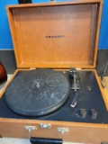 (BAY 7) CROSLEY TURNTABLE WITH LEATHER CASING. ITEM IS SOLD AS IS WHERE IS WITH NO GUARANTEES OR