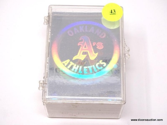 CLEAR PLASTIC BOX CONTAINING ASSORTED BASEBALL CARDS. ITEM IS SOLD AS IS WHERE IS WITH NO GUARANTEE