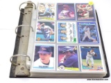 BINDER HALF FILLED WITH BASEBALL CARDS TO INCLUDE KEN GRIFFEY JR., CARLTON FISK, CAL RIPKEN JR.,