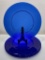 (3C) SET OF FOUR 13 1/4-INCH COBALT BLUE GLASS CHARGERS WITH PRESSED WAFFLED PATTERN.