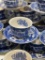 (5E) ASSORTED BLUE WILLOW TRANSFERWARE CUPS AND SAUCERS. NOT ALL ARE IDENTICAL BUT MOST ARE MARKED