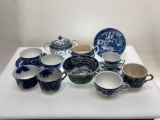 (7G) ASSORTED BLUE WILLOW, TRANSFERWARE, FLOW BLUE, AND OTHER BLUE AND WHITE TEACUPS, SAUCERS AND