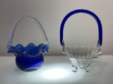 )9I) TWO COBALT BLUE AND CLEAR ART GLASS BASKETS WITH FLUTED RIMS, APPROX 8 INCHES TALL