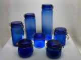 (4D) CONTEMPORARY COBALT BLUE GLASS BAIL TOP CANISTERS. TALLEST MEASURES 13 INCHES.