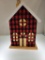 WOODEN CHRISTMAS FARM HOUSE WITH RED BUFFALO CHECK FABRIC ON FRONT - MEASURES APPROX 10