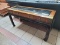 BASSETT OAK AND MAHOGANY FINISH CONSOLE TABLE WITH SMOKED GLASS TOP AND ETCHED ASIAN LANDSCAPE