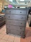 (R1) ASPENHOME OXFORD 5 DRAWER CHEST IN PEPPERCORN WITH PULL OUT CLOTHES HANGING RODS. RETAILS FOR