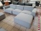 (R3) FEATURING DISTINGUISHED LINES AND OVERSTUFFED CUSHIONS, THE KOBE SECTIONAL SOFA IN LIGHT GRAY