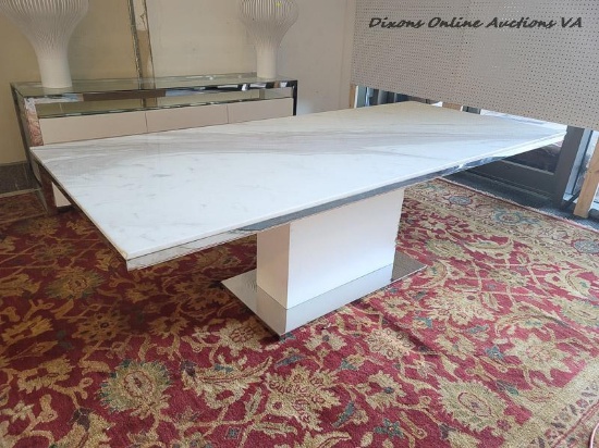 (DR) MEET MELROSE. THIS MODERN DINING TABLE FEATURES A WHITE MARBLE TOP, REINFORCED WITH GLASS, FOR