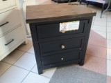 A-AMERICA STONE CREEK 3 DRAWER NIGHTSTAND. RETAILS FOR $623 ONLINE. MEASURES 26 IN X 18.5 IN X 29.5