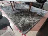 (R3) MODERN 8 FT X 10 FT SILVER GRAY SHAG AREA RUG. ITEM IS SOLD AS IS WHERE IS WITH NO GUARANTEES