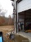 (OUTSIDE GARAGE) METAL WINDMILL WEATHER VANE - 26 IN X 128 IN, ITEM IS SOLD AS IS, WHERE IS, WITH NO
