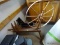 (GARAGE) MAPLE SPINNING WHEEL PLANTER- 36 IN X 8 IN X 34 IN, ITEM IS SOLD AS IS, WHERE IS, WITH NO