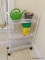 (LAUNDRY) METAL ROLLING 3 SHELF STORAGE RACK AND CONTENTS- 20 IN X 8 IN X 30 IN, ITEM IS SOLD AS IS,
