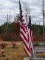 (OUTSIDE BACK) 3 US FLAGS WITH POLES AND ONE FLAG TO BE REMOVED FROM WOODEN POLE, ITEM IS SOLD AS
