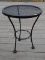 (OUTSIDE BACK) METAL MESH WIRE SIDE TABLE- 16 IN DIA, X 21 IN, ITEM IS SOLD AS IS, WHERE IS, WITH NO