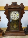 (GARAGE) ANTIQUE WALNUT GINGERBREAD MANTEL CLOCK WITH PAINTED GLASS, HAS KEY AND PENDULUM- 14 IN X 5