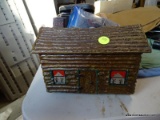 (GARAGE) CAST IRON LOG CABIN BANK WITH CONTENTS- 9 IN X 5 IN X 7 IN, ITEM IS SOLD AS IS, WHERE IS,