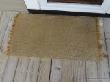 (OUTSIDE FRONT) SISAL RUG- 48 IN X 26 IN, ITEM IS SOLD AS IS, WHERE IS, WITH NO GUARANTEE OR