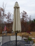 (OUTSIDE BACK) PATIO UMBRELLA AND STAND- 8FT, ITEM IS SOLD AS IS, WHERE IS, WITH NO GUARANTEE OR