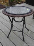 (OUTSIDE BACK) FOLDING METAL AND PLEXIGLASS TOP SIDE TABLE- 18 IN DIA X 17 IN, ITEM IS SOLD AS IS,
