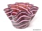 Venetian style handkerchief vase formed of pink and cranberry aventurine glass striped with opaque