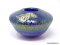 Cobalt blue glass bowl with an iridescent, stretched glass finish decorated with a free form applied