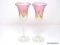 Pair of stemmed toasting glasses with an iridescent finish. The cup is internally decorated in pink