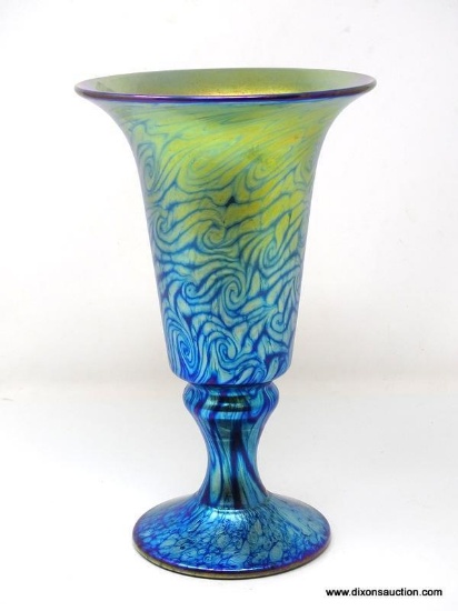 Footed vase with brilliant blue and gold iridescent and king Tut design. Created by Lundberg