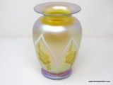 A gold iridescent vase having a wide flaring rim over wide shoulders tapering to form a rolled foot