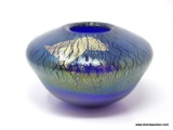 Cobalt blue glass bowl with an iridescent, stretched glass finish decorated with a free form applied