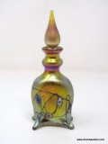Iridescent gold footed perfume bottle with millefiori and iridescent blue webbing design. Design by