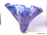 This is a table vase or platter. Red and blue translucent colors with ribbed base. Free form style.