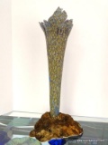 This is a volcanic vase by Victor Chiarizia. Muted purple interior with textured brown and blue