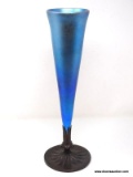 Iridescent blue modified bud vase on bronze colored foot. 16