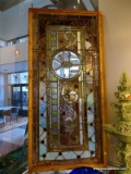 Asymmetrical Leaded Glass Panel Consisting Of Beveled Leaded, Stained, Rippled, And Jeweled Glasses.