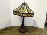 Stained And Slagged Glass Floral Pattern Lamp With Bronze Toned 4 Legged Base. Measures 18 In X 28