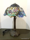 Slagged Glass And Stained Glass Lamp With Rose Pattern And Bronze Toned Base. Primary Colors Are