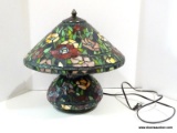 Slagged Glass Floral Themed Lamp With Slagged Glass Base. Primary Colors Include Green, Red, And