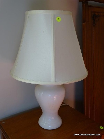 WHITE PORCELAIN BEDSIDE LAMP WITH SHADE. ITEM IS SOLD AS IS WHERE IS WITH NO GUARANTEES OR WARRANTY.