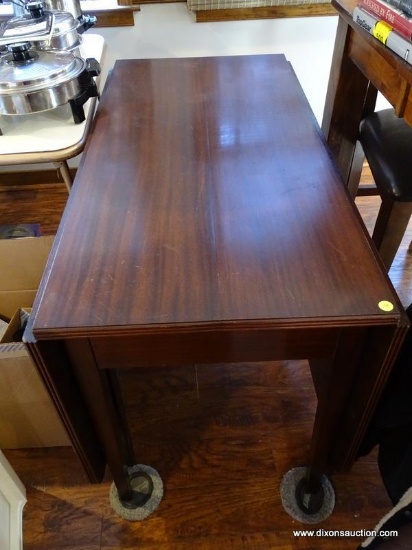 DROP LEAF MAHOGANY TABLE. 42 INCHES LONG, 21 WIDE, 29 TALL. ITEM IS SOLD AS IS WHERE IS WITH NO