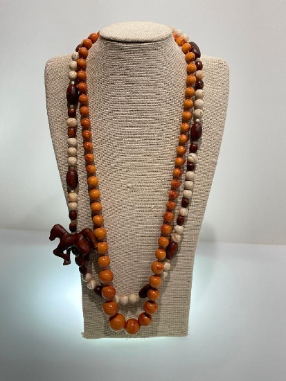 TWO TROPICAL CHUNKY WOODEN BEADED NECKLACES - ONE WITH CARVED HORSE CHARM - EACH MEASURES 28"L