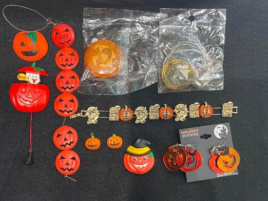 ASSORTED HALLOWEEN COSTUME JEWELRY INCLUDING PINS, EARRINGS, CHARM BRACELET, AND MORE!