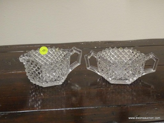 (R1) PRESSED GLASS CREAM AND SUGAR SET WITH DIAMOND PATTERN. ITEM IS SOLD AS IS WHERE IS WITH NO