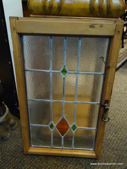 (WIN) FRAMED STAINED GLASS WINDOW HANGER. MEASURES 19 IN X 31.5 IN. ITEM IS SOLD AS IS WHERE IS WITH