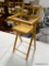 (R2) FOLDING DOLL HIGH CHAIR. MEASURES 20.5 IN TALL. ITEM IS SOLD AS IS WHERE IS WITH NO GUARANTEE