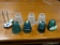 (R2) ASSORTED LOT TO INCLUDE 4 GREEN GLASS INSULATORS, 3 GLASS SHADES, AND A THALHIMERS PAPER CLIP