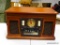 (R2) ALL-IN-ONE STEREO SYSTEM WITH PHONOGRAPH, CASSETTE DECK, CD PLAYER, AND AM/FM RADIO. ITEM IS